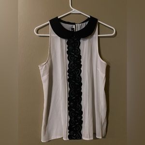 Black and white sleeveless top.